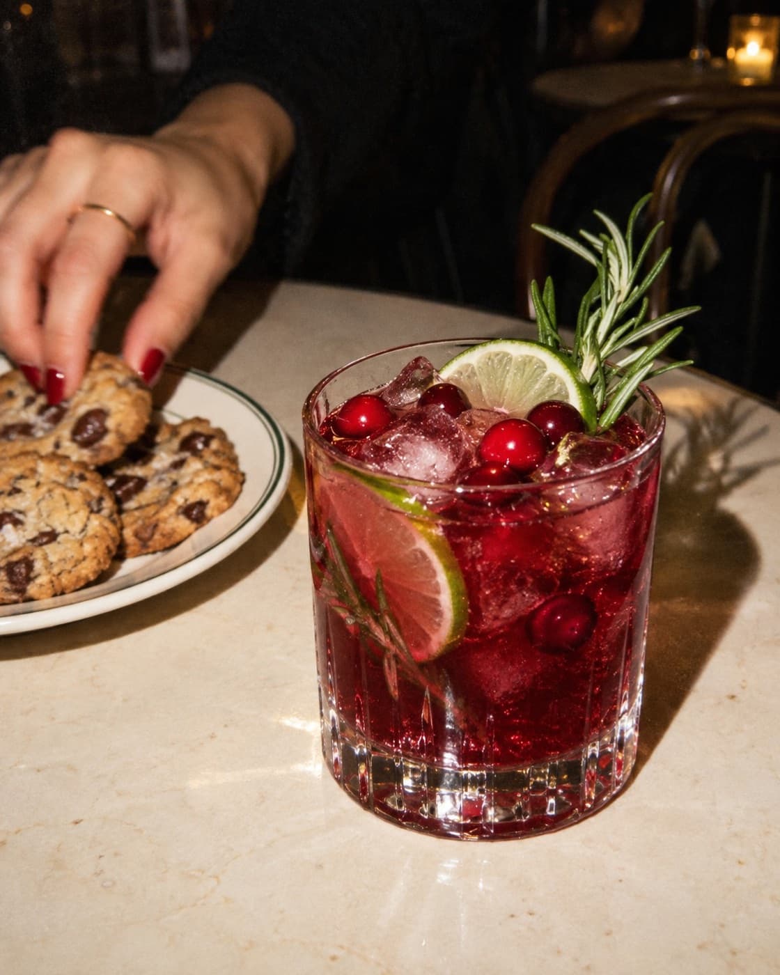 Zero-proof cranberry rosemary punch, flash photo