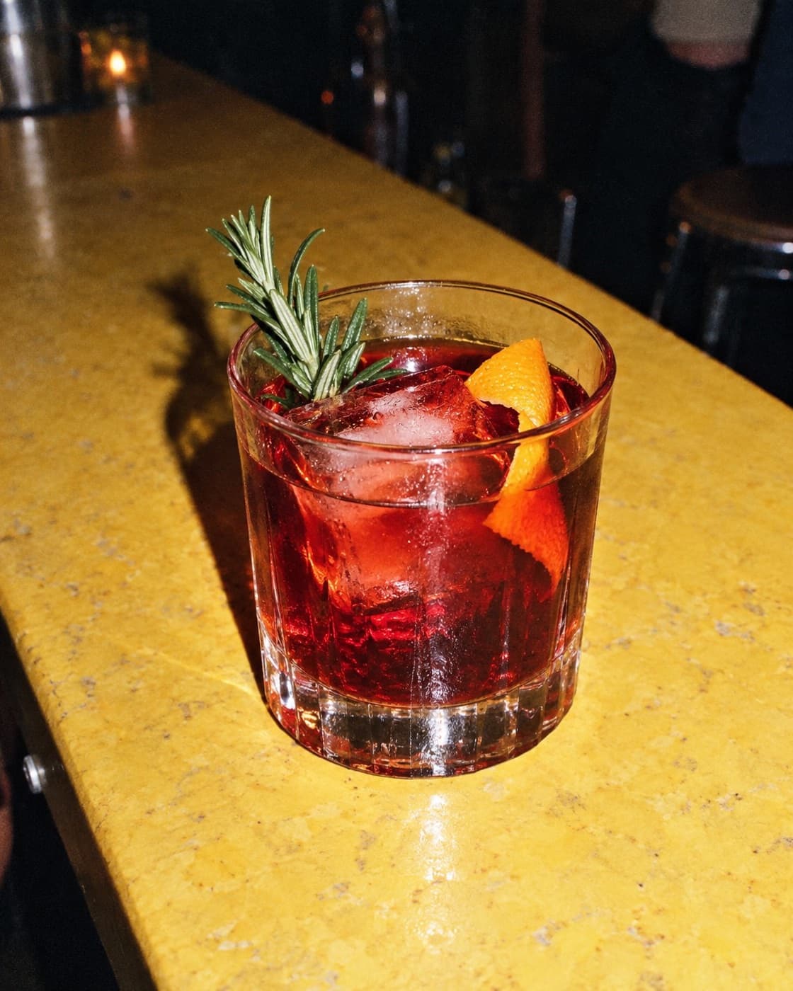 Zero-proof cranberry rosemary negroni, flash photo